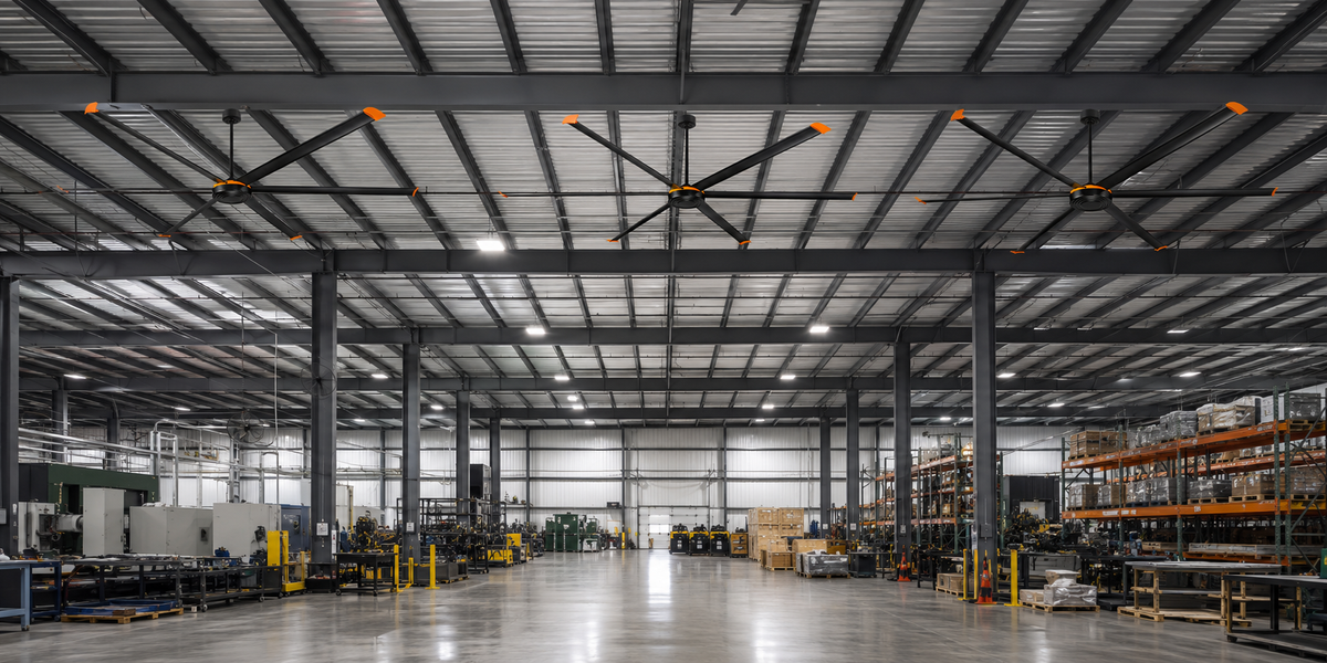 Large industrial HVLS ceiling fans installed in a spacious warehouse ceiling.