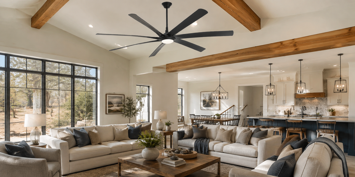 Large black industrial-style ceiling fan mounted on a high ceiling in a modern living room.